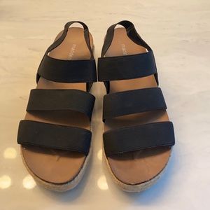 Black platform sandal.